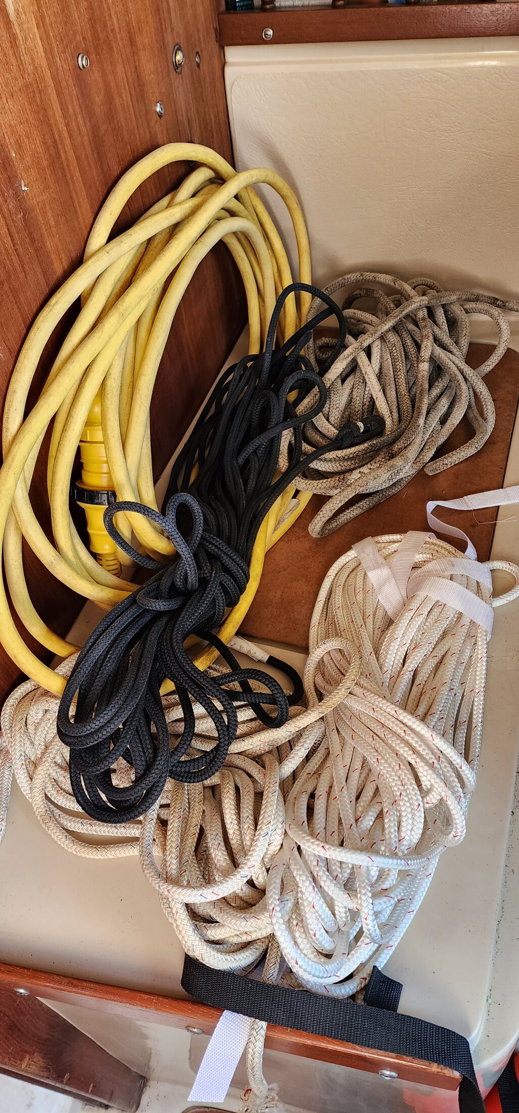 Coiled running-rigging lines aboard the boat